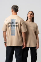 Oversize Backprint Interlock Tee - CHASE THE IMPOSSIBLE (BEIGE)